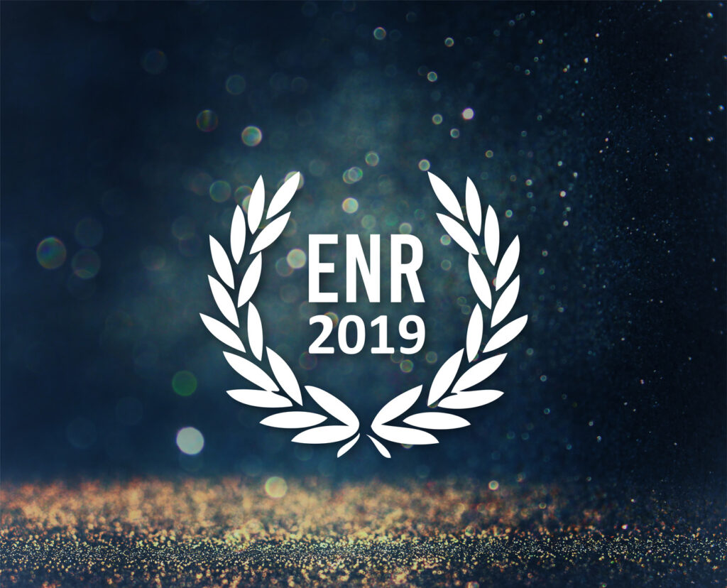 Laurel wreath graphic with the text "ENR 2019" in the center against a dark, sparkling background.