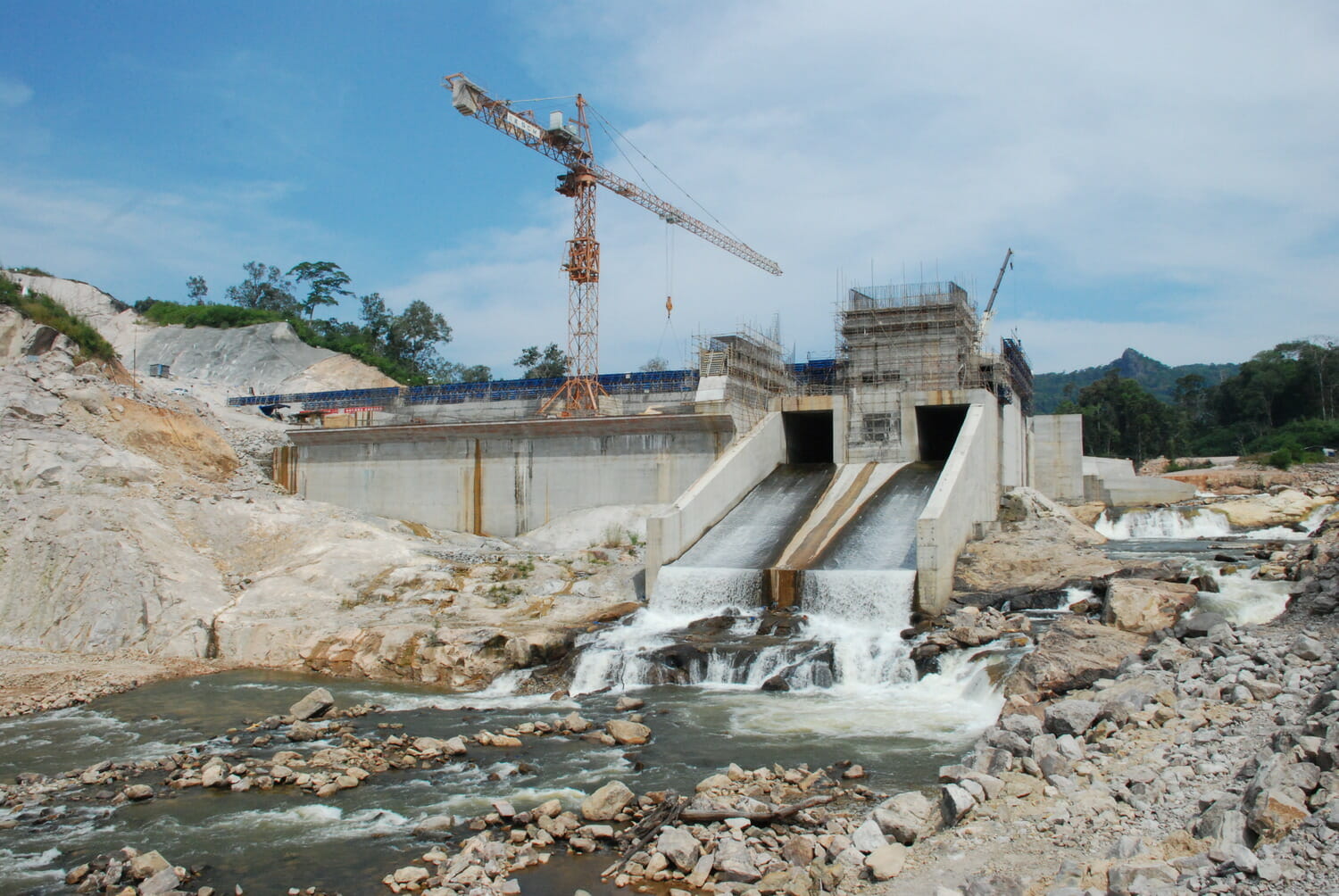 The construction of a dam on a river.